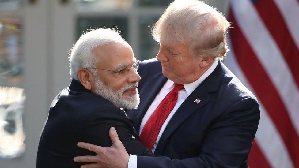 President Donald Trump (R) and Indian Prime Minister Narendra Modi embrace outside the White House in 2017.