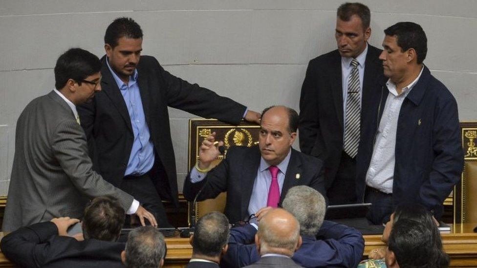 The President of the Venezuelan National Assembly, Julio Borges (2-R) speaks to deputies during a session in Caracas, on May 23, 2017.