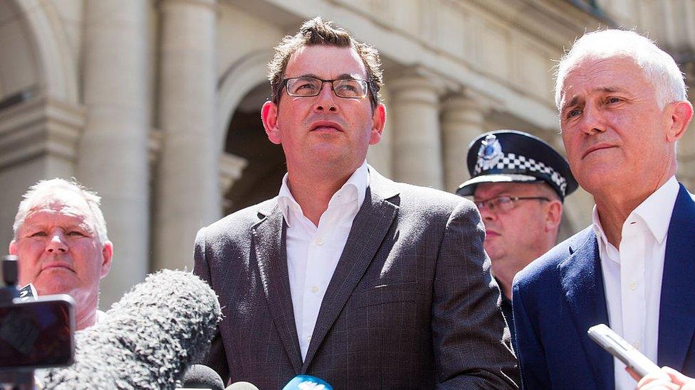 Premier Daniel Andrews speaks to the media on Sunday, flanked by Lord Mayor Robert Doyle and Prime Minister Malcolm Turnbull