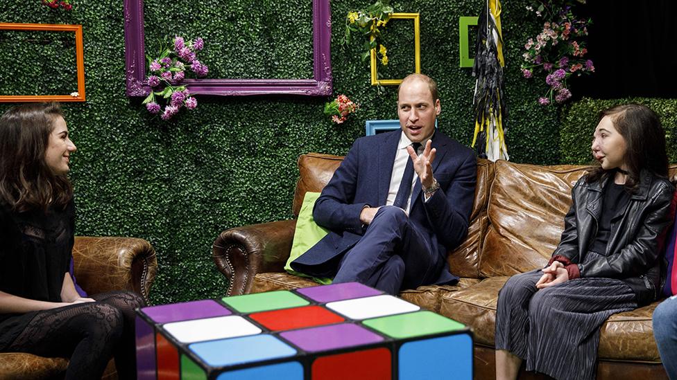 Prince William talking to people at the launch of the "stop, speak, support" taskforce