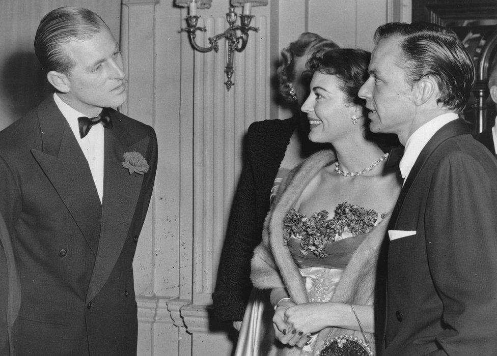 Prince Philip chatting with Frank Sinatra and his wife the actress Ava Gardner at London's Empress Club (December 1951)