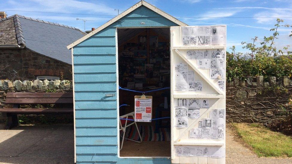 a shed containing sketches done by the locals