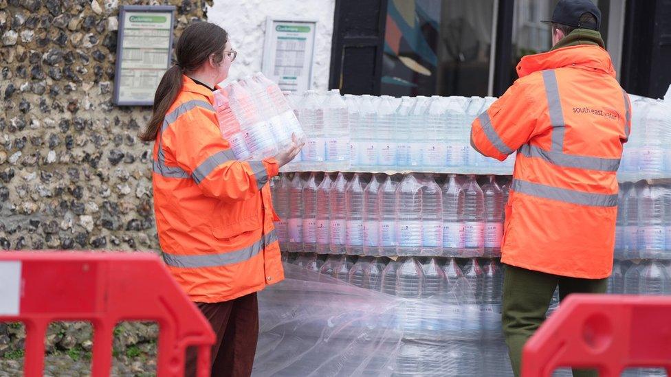 South East Water staff unwrap water bottles