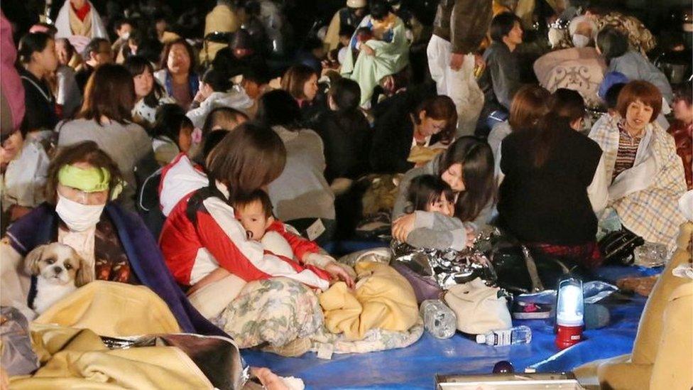 Residents take shelter at the town hall of Mashiki, in Kumamoto, southern Japan, after the earthquake early Friday, April 15, 2016.