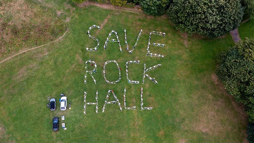 Aerial view of message Save Rock Hall on grass near Rock Hall