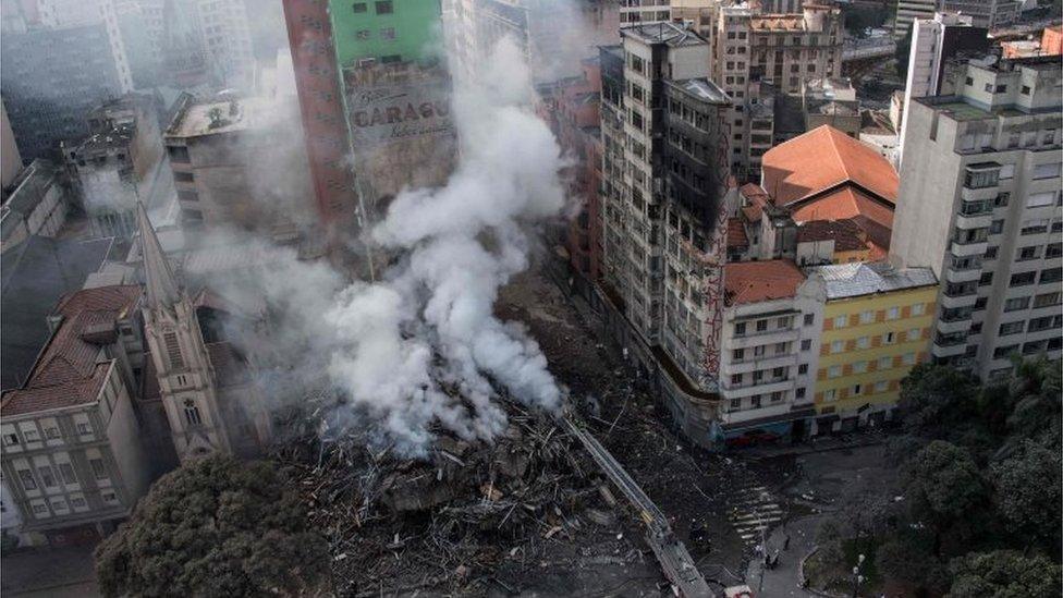 Firefighters work to extinguish the fire in a building that collapsed after catching fire in Sao Paulo, Brazil, on May 1, 2018