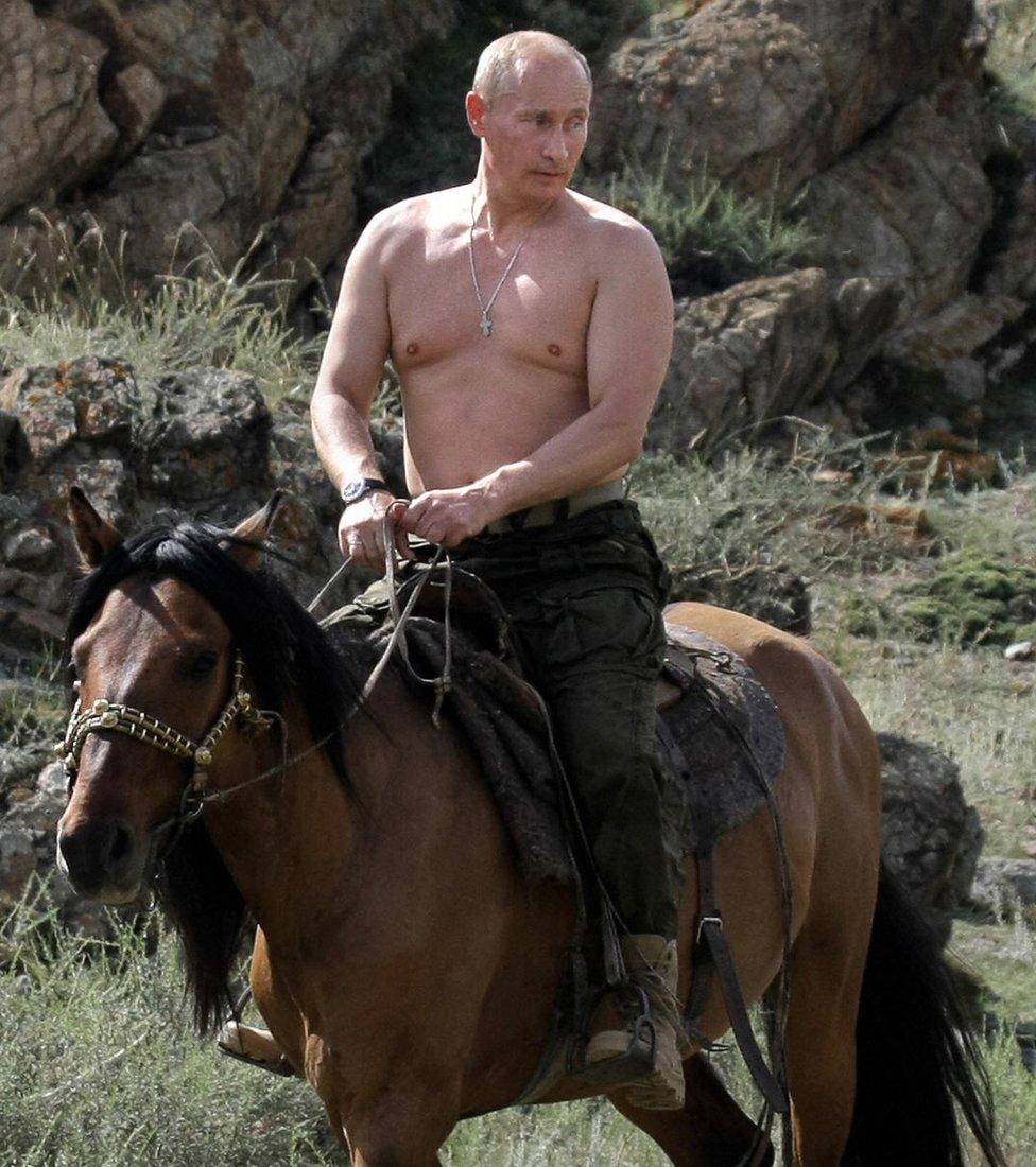 A bare-chested Vladimir Putin horseback