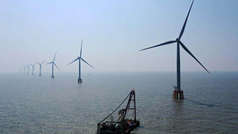 Wind turbines in the ocean.