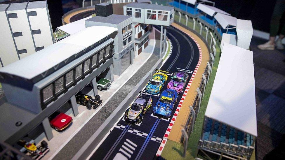 A close up of the Scalextric track modelled on the Woodcote and Luffield sections of the circuit