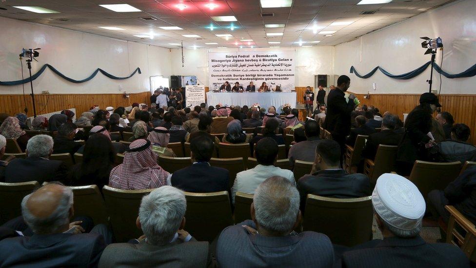 Syrian Kurdish representatives attend a conference in Rmeilan on 16 March 2016