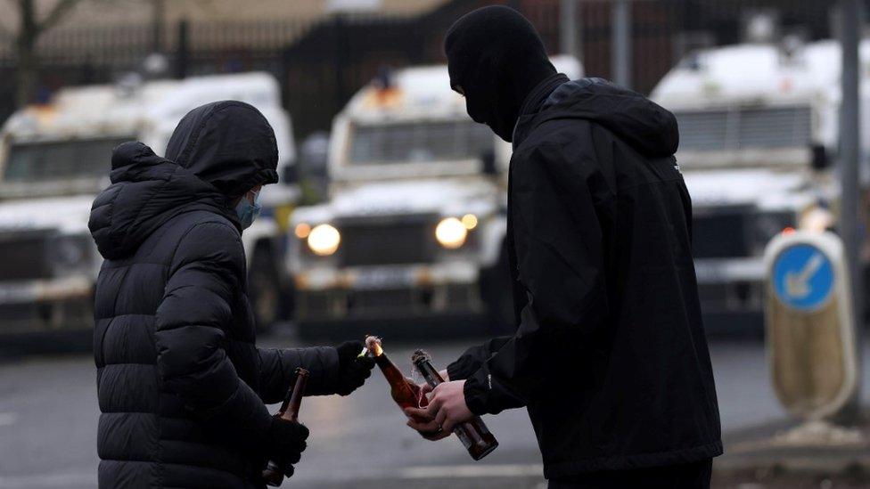 Rioters light petrol bombs on the Springfield Road in Belfast, 8 April