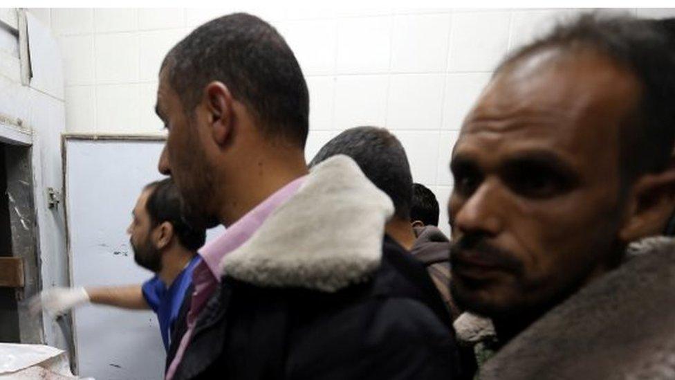 People gather in a hospital morgue in Gaza. Photo: 28 October 2018