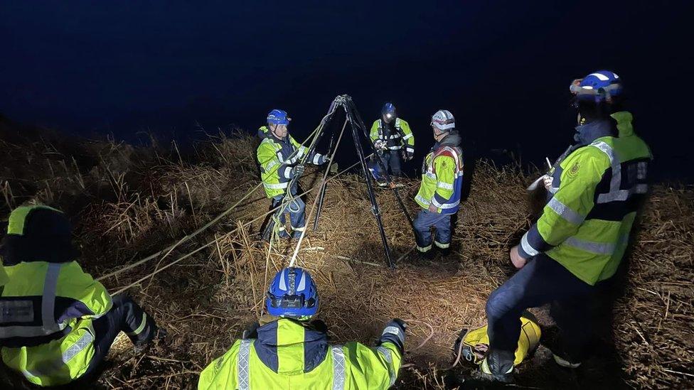 Coastguard and lifeboat teams on cliff