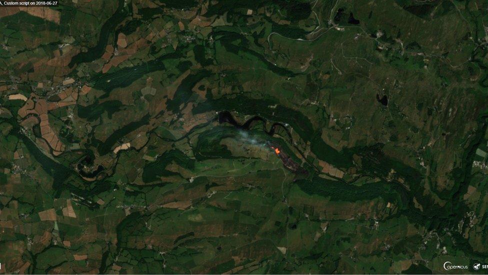 A satellite image of the fire in Cwm Rheidol on Wednesday around midday when the satellite passed over the area. The grey area is the ‘burn scar’ and the orange is the still burning fire.