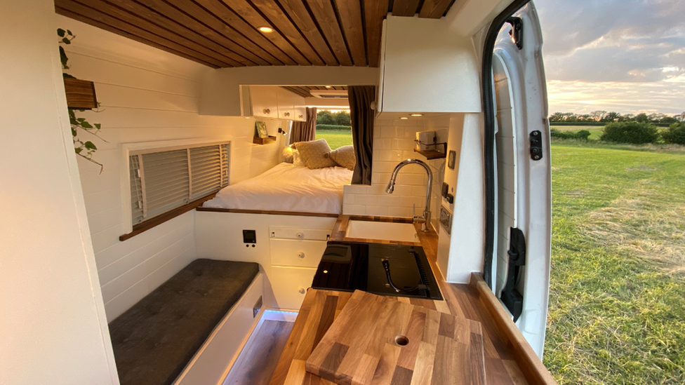 A picture of an interior of a van conversion