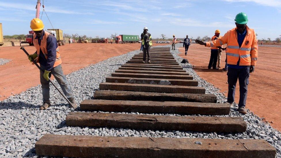 Construction workers building a railway