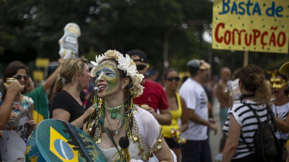 A 'bloco da rua' or street carnival band protests corruption under the theme 'Lava Jato' or Car Wash - the federal police investigation launched in response to the scandal that broke out in 2014 involving the state oil company Petrobras - in Sao Paulo, Brazil, on January 30, 2016.