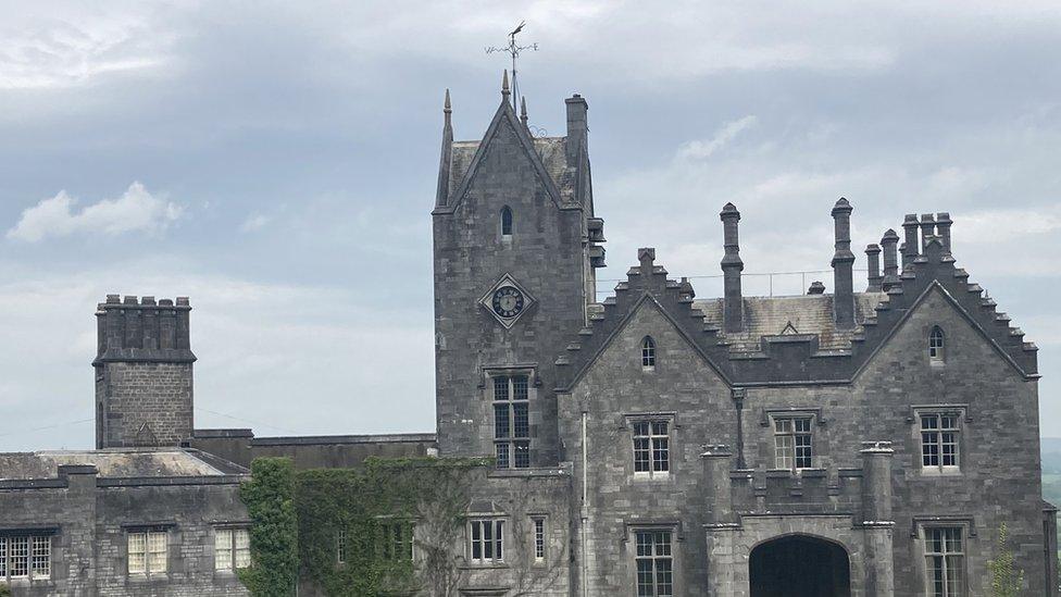 manor with clock in the tower