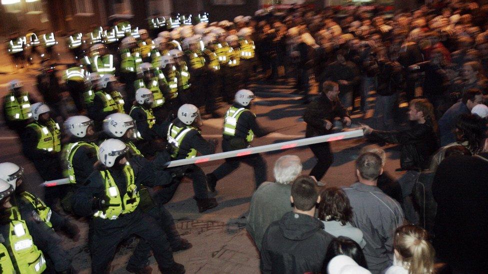 Police face demonstrators 27 April 2007 in Tallin, during a protest against plans to move the Bronze Soldier statue, a Soviet World War II memorial