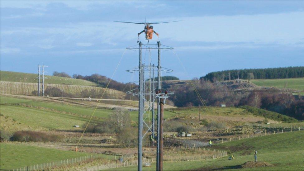 Helicopter and electricity towers