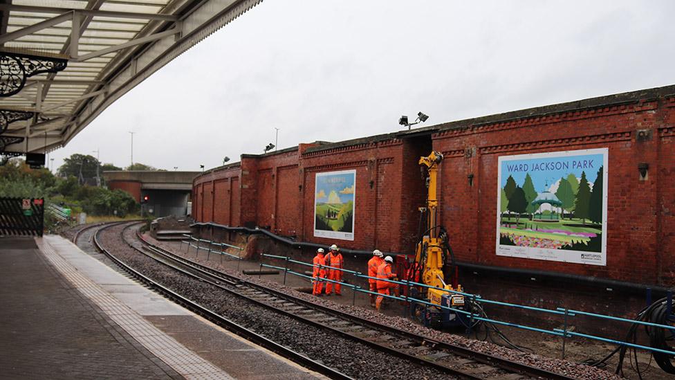 Track and workers at Hartlepool railway station carrying out piling work