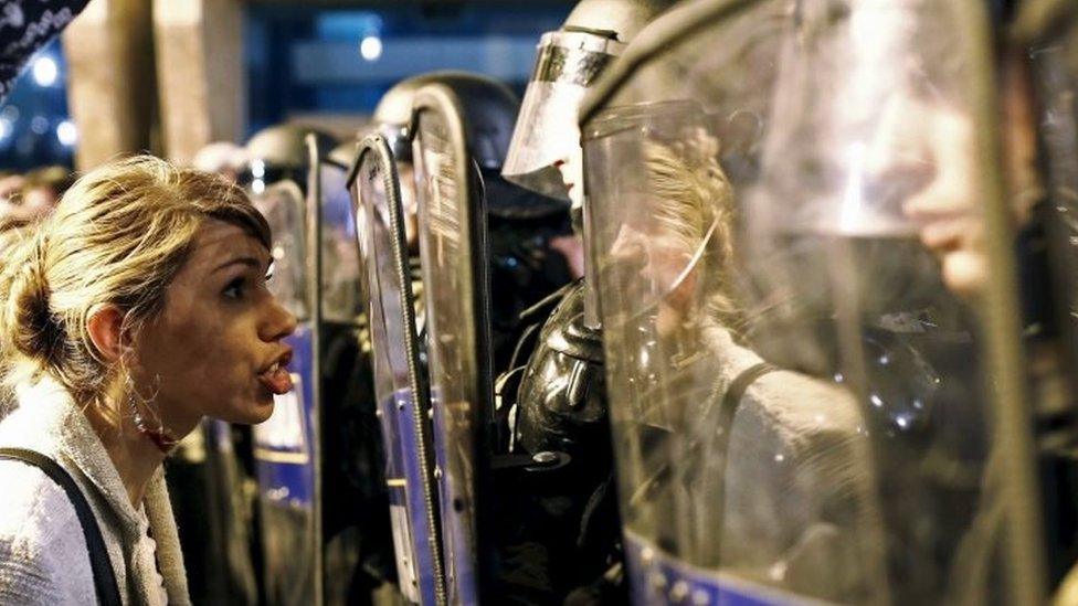 A protester shouts at riot police in Skopje. Photo: 12 April 2016