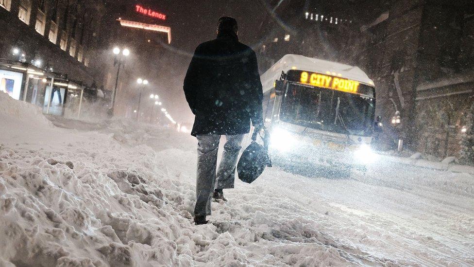 On the streets of Boston, snow falls from a massive US winter storm, 4 January 2018