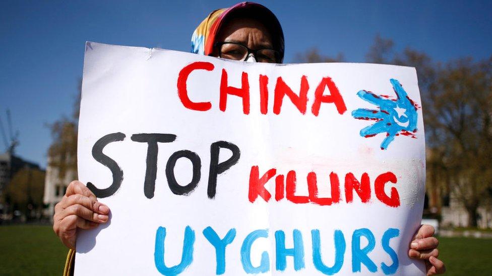 Members of the Uyghur community at a protest in London.