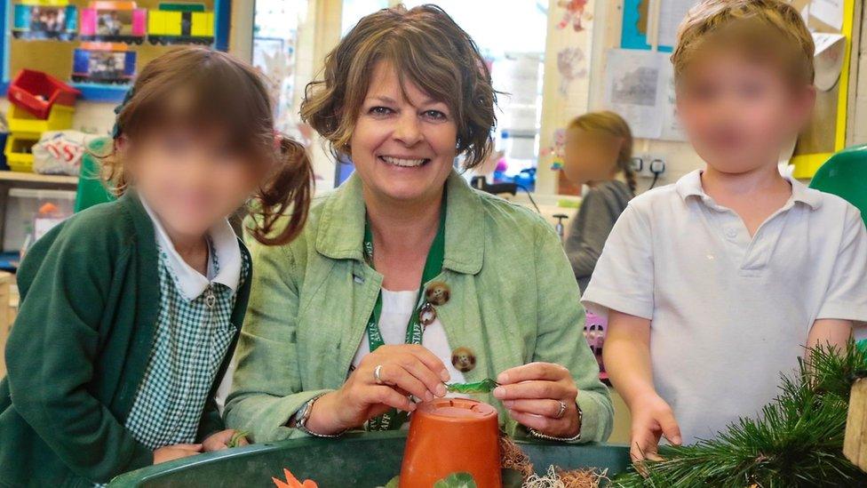 Ruth Perry with children in the school