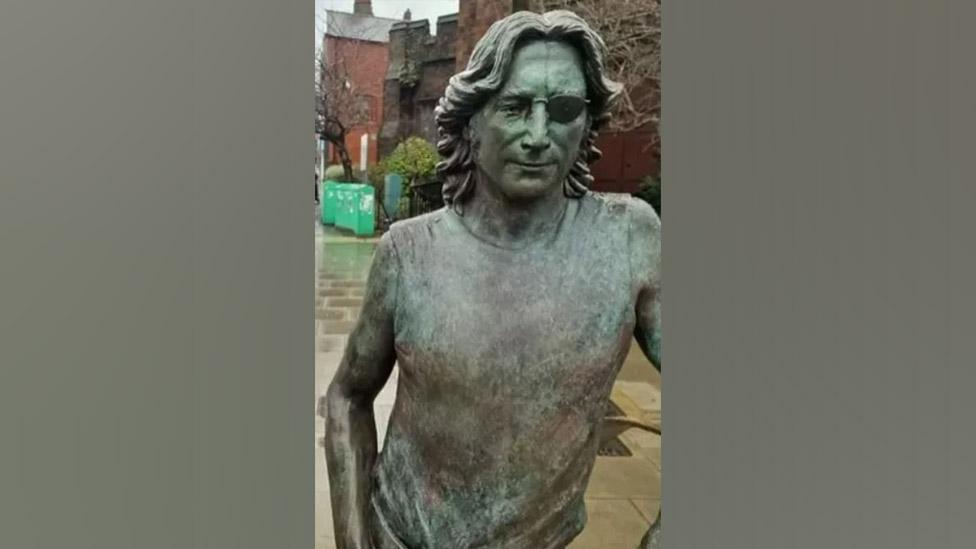 John Lennon Peace Statue showing damage