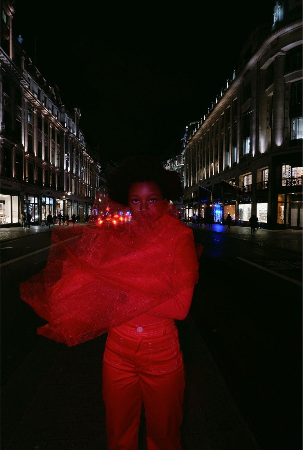 A woman standing in the road