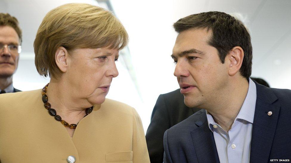 German chancellor Angela Merkel (L) talks with Greek prime minister Alexis Tsipras at the beginning of the second day of the fourth European Union (EU) eastern Partnership Summit in Riga, 22 May 2015