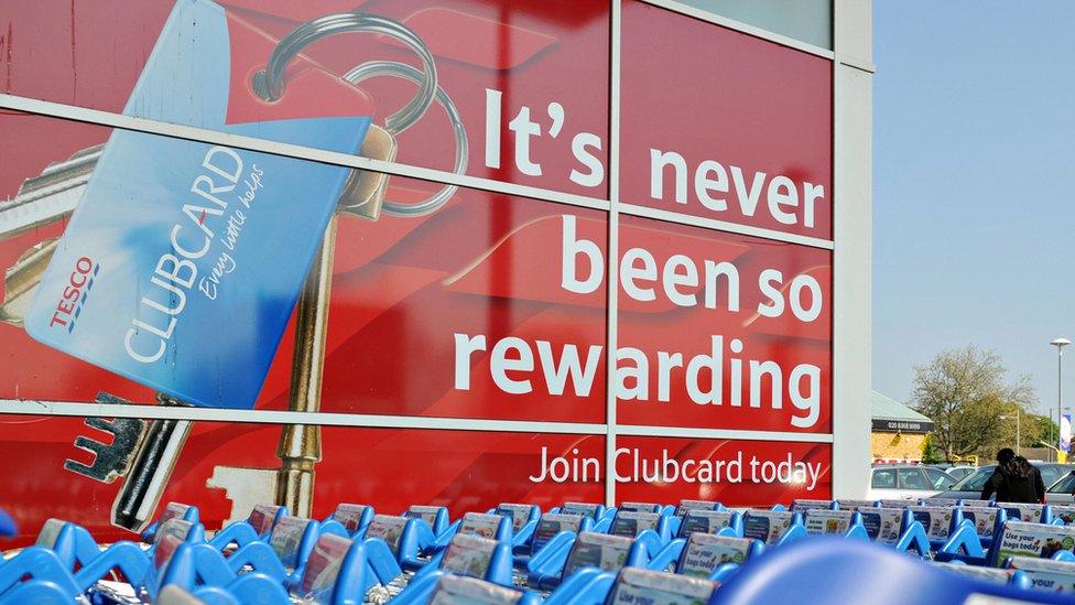 Tesco clubcard sign with trolleys