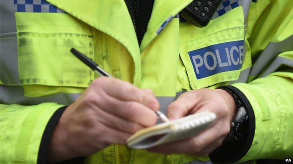 Police officer with notebook