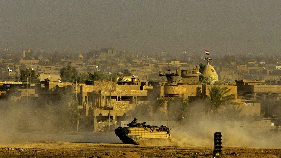 US marine vehicle patrols the Jolan neighborhood of the restive Sunni Muslim city of Falluja on 11 November 2004