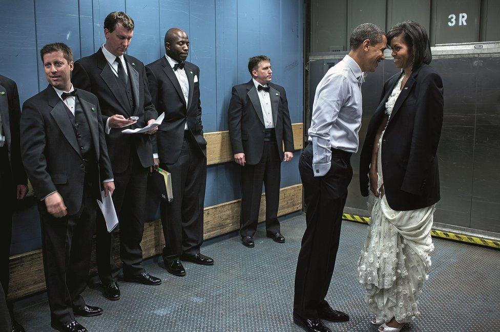 Obama kisses Michelle in a lift