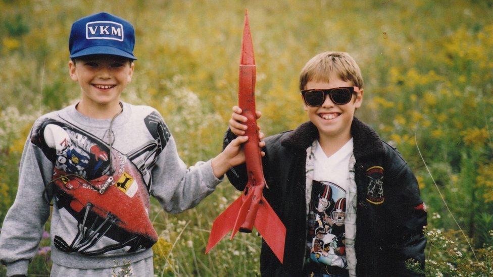 Mitch Brogan (L) as a young boy, with a friend