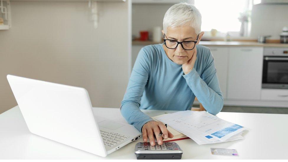 A woman using a calculator