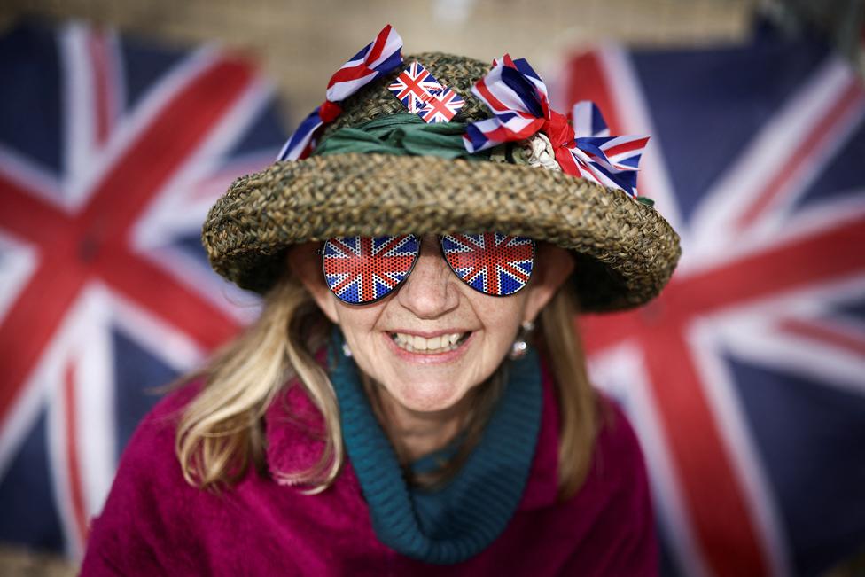 Royal fan Sally Scott poses on the Mall outside Buckingham Palace ahead of the Coronation.