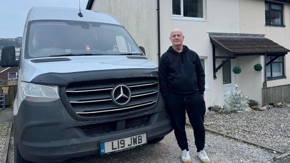 Jeff Boorer in front of his van