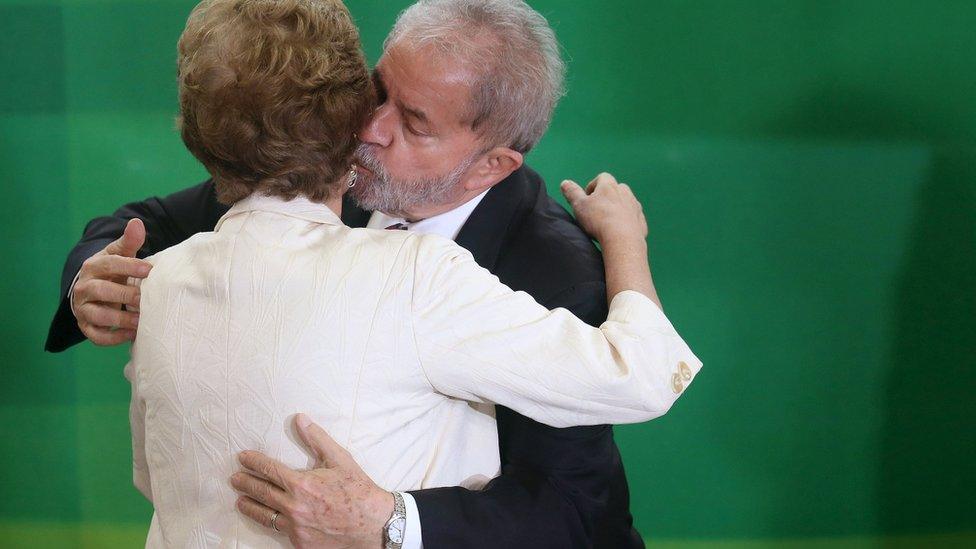 Brazi's President Dilma Rousseff greets former president Luiz Inacio Lula da Silva during his appointment as chief of staff, at Planalto palace in Brasilia on 17 March