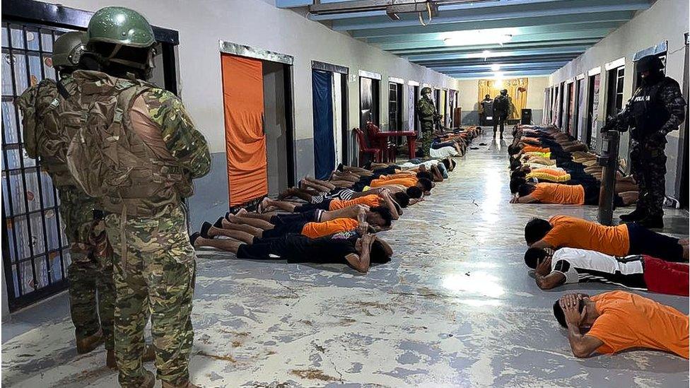 Soldiers monitor inmates at a jail in the city of Guayaquil