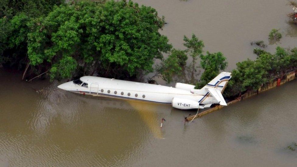 An aerial view of a partially submerged airplane is pictured in a flood affected area in Chennai, India, December 3, 2015