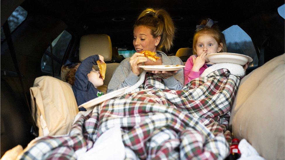 family in car