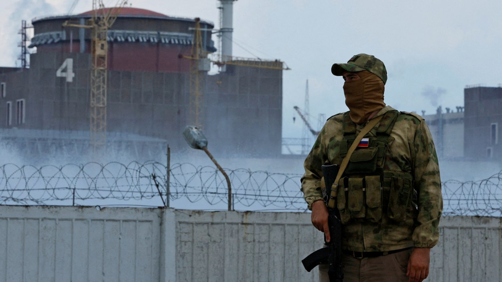 A Russian soldier guards near the Zaporizhzhia nuclear power plant. Photo: August 2022