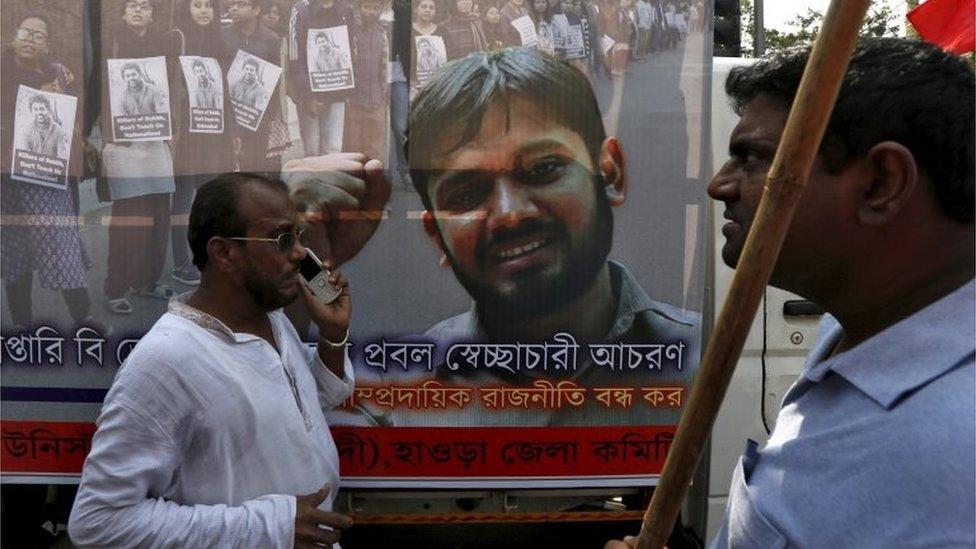 Supporters of Communist Party of India-Marxist (CPI-M) walk in front of a banner featuring Kanhaiya Kumar, a Jawaharlal Nehru University (JNU) student union leader accused of sedition, during a protest demanding the release of Kumar in Kolkata, India, February 21, 2016.