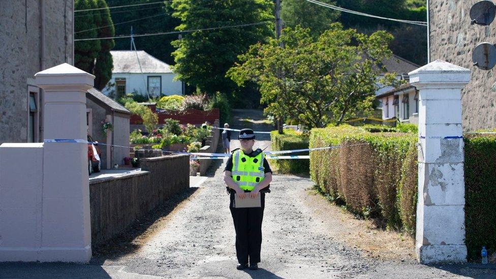 Police officer at cordoned off lane