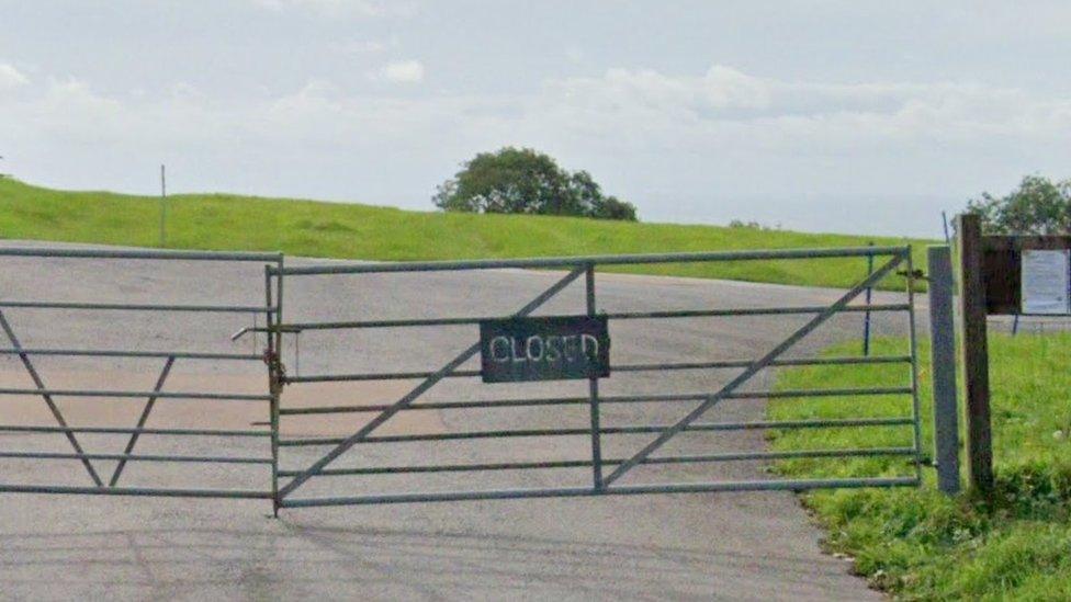 Closed sign on Lyme Regis park-and-ride gate