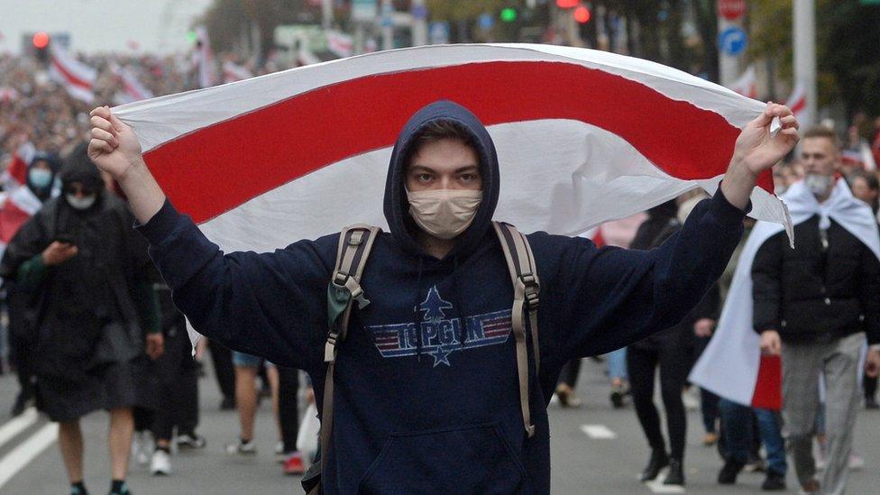 A protester attends a rally against leader Alexander Lukashenko