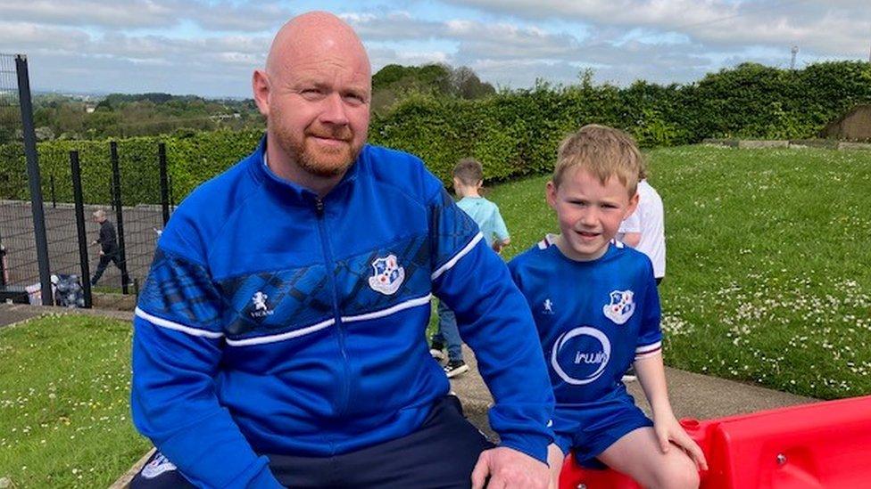 Neil Anderson, Direcor of Loughgall Football club and his son Alfie at The Cope Primary School in Loughgall football attire